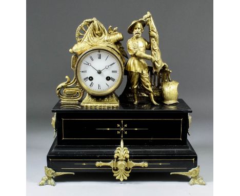 A late 19th Century French gilt spelter and black slate mantel clock by A.M., No. 2464 * 64, the 3.5ins diameter white enamel