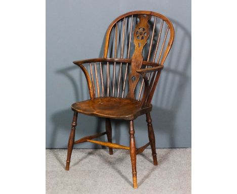 A 19th Century yew and ash seated stick back Windsor armchair with two tier stick back, on turned underframe, and a wheelback