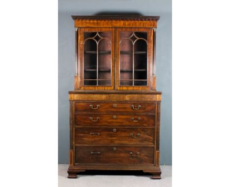 A George III mahogany Secretaire bookcase, the upper part with dentil moulded cornice, fitted two shelves enclosed by a pair 