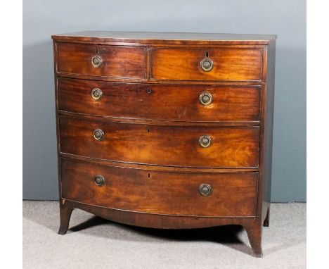 A late George III mahogany bow front chest with square edge to top, inlaid with stringings, fitted two short and three long d