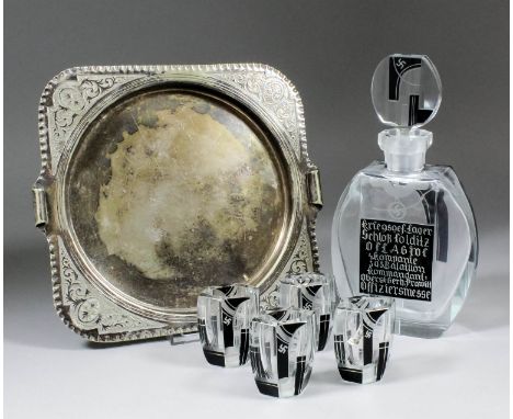A World War II German Art Deco glass decanter and stopper, and four matching shot glasses from The Officers Mess at Colditz C