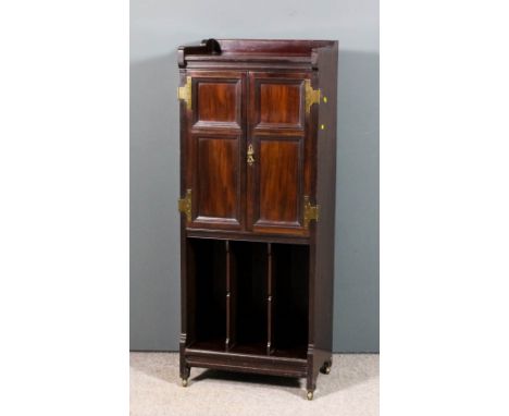 A late Victorian mahogany tray top music cabinet by C.Hindley & Sons, Oxford Street, London, fitted three sliding trays enclo