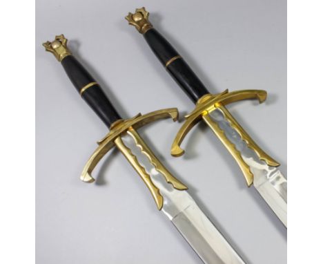 A pair of modern fantasy two handed broadswords, each with 35ins bright steel double edged blade, heavy cross guard and pomme