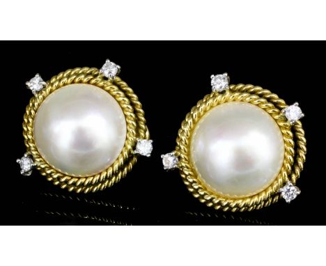 A pair of modern gold coloured metal mounted pearl and diamond set earrings (for pierced ears), the faces set with a mabe pea