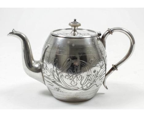 A late 19th/early 20th Century Russian silver circular teapot of bulbous form, engraved with stylised floral ornament and ent