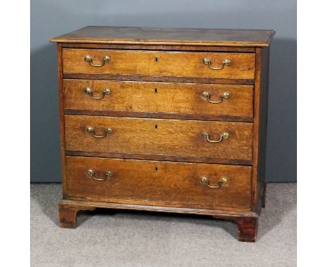 An 18th Century oak chest with moulded edge to top, fitted four long graduated drawers, on bracket feet, 34ins wide x 18.75in