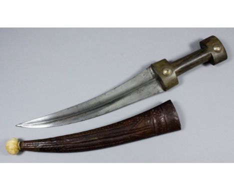 A late 19th/early 20th Century North African dagger, the 11ins curved steel blade with carved hardwood handle, 16.25ins overa