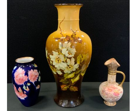 A Doulton Lambeth vase, decorated with Dog Roses, on a yellow and brown ground, 42cm high, c.1880;  a Royal Doulton ovoid vas