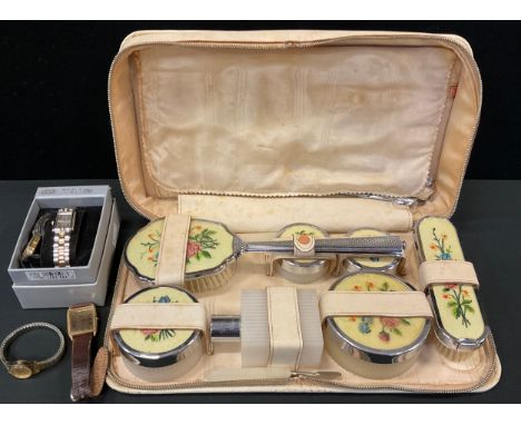 A mid 20th century vanity case, with chrome backed brushes and bottles, wristwatches, Limit, Accurist, Timex;  etc 