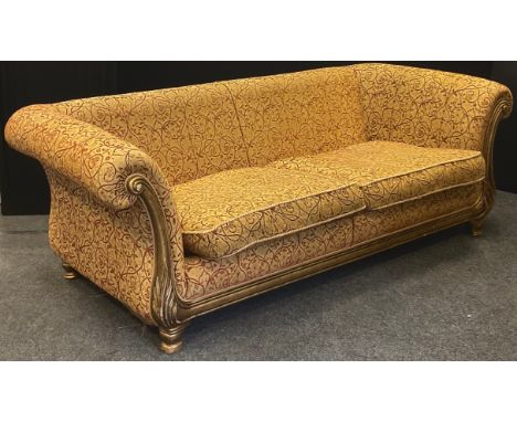 A large three seater sofa, scroll arms 