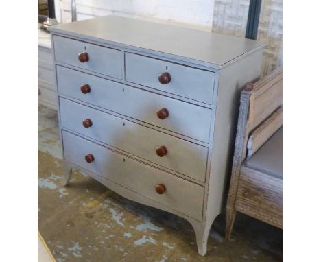 CHEST, 19th century in a distressed grey painted finish with two short above three long drawers and a shaped apron on swept b