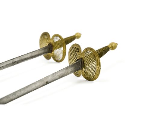 Pair of fencing swordsFRANCE, LATE 18TH CENTURYPierced bronze detailing, one decorated blade. 