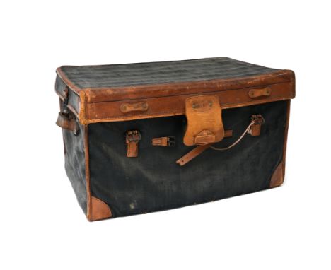 MOYNATLight trunk, known as an "English trunk", ca. 1880Wicker, upholstered in coated fabric and Cognac leather. Signed "Moyn
