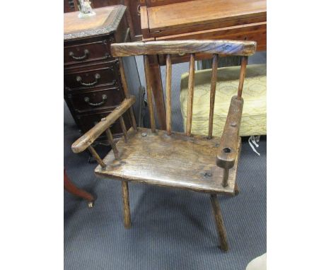 An 18th century ash and elm stick back armchair  