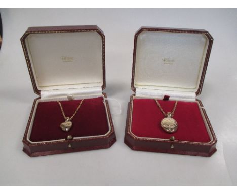Two diamond set lockets, the first an oval locket set with 23 small round brilliant diamonds in a 'cushion' formation, stampe