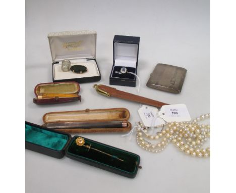 A 9ct topaz and diamond ring, size M (cased), a rose cut diamond set stick pin (cased), a 9ct mounted 'New Zealand jade' broo