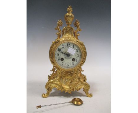 An 18th century style brass cased mantel clock, the continental eight-day drum movement with outside count wheel striking on 