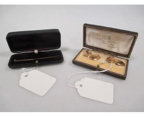 A pair of 9ct cufflinks, cased, together with an adaptable pearl stick pin/stud, cased (2)  