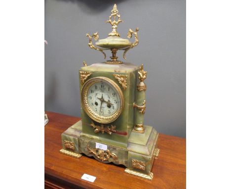 A 19th century onyx and gilt metal mounted mantel clock, 44cm high  