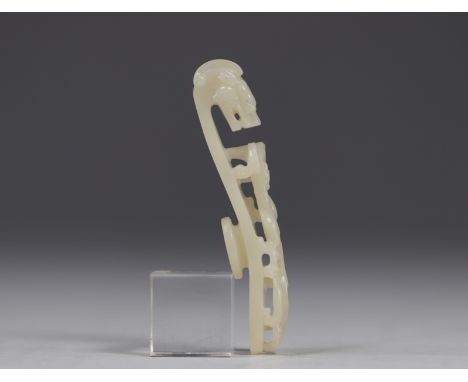 China - Pale celadon jade fibula decorated with Qilong dragons walking among stylised plants. It ends in a dragon's head. The