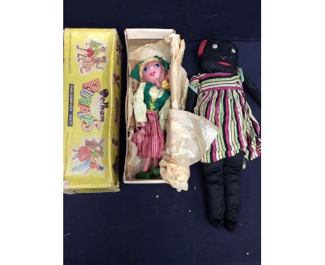 A Pelham puppet and a black rag doll  