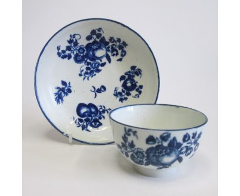 A Worcester tea bowl and saucer, underglaze blue with fruit sprigsCirca 1775Tea bowl diameter 8cm, saucer diameter 12.5cmCond