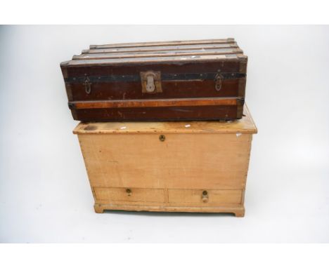 A 19th Century pine mule chest with two base single drawers, on bracket feet along with a 1920s travel trunk.
