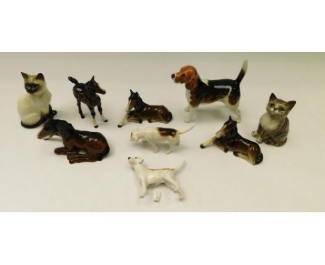 Beswick - nine ceramic figures inc. four brown horses, two cats, two small hunting hounds and a larger hunting hound. One sma