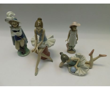 A collection of four Nao figures of young children.