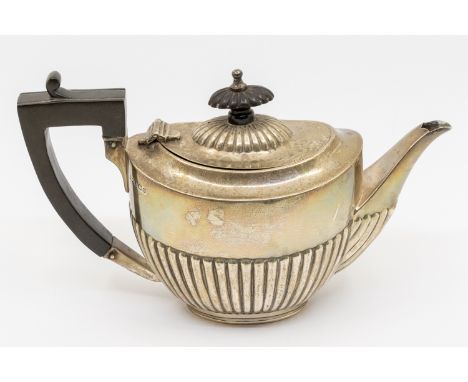 A George V silver bachelor's teapot, gadrooned lower section, ebony handle and finial, hallmarked Mappin & Webb, Sheffield, 1