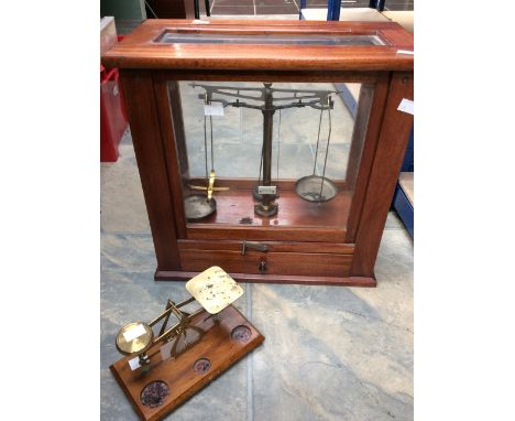 A 19th Century laboratory scales in glazed mahogany case with weights in cabinet drawer along with Victorian office counter s