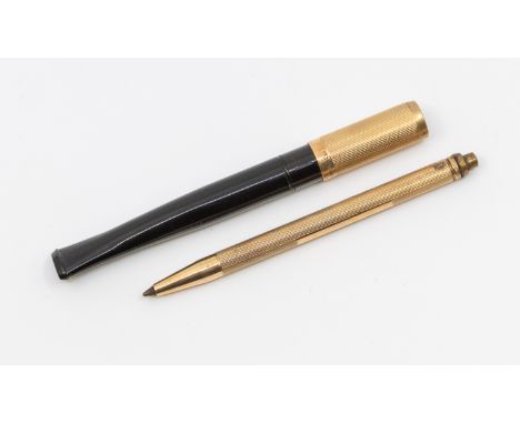 A 1920's 9ct gold tipped sprung loaded cigarette holder with black mouth piece, length approx 95mm,. along with a 9ct gold mi
