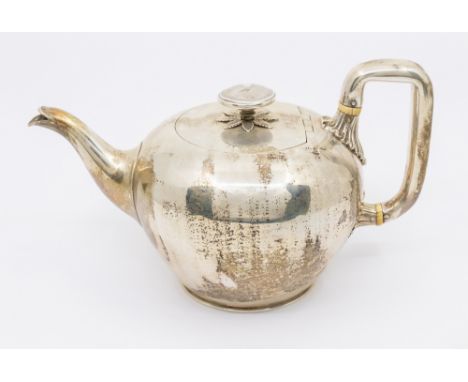 A Victorian silver bullet shaped tea pot, c shaped handle and domed circular finial with shrubbery underneath, hallmarked by 