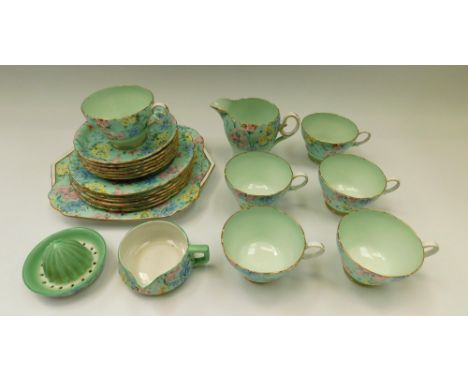 A Shelley Melody design part-tea service: 6 cups and saucers, juicer, milk jug, sandwich plate and 6 side plates