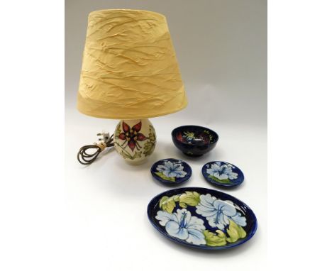 Moorcroft: a Columbine 1980s lamp with shade, an anemone blue bowl (1980s) two blue Hibiscus coasters/dishes and a blue Hibis