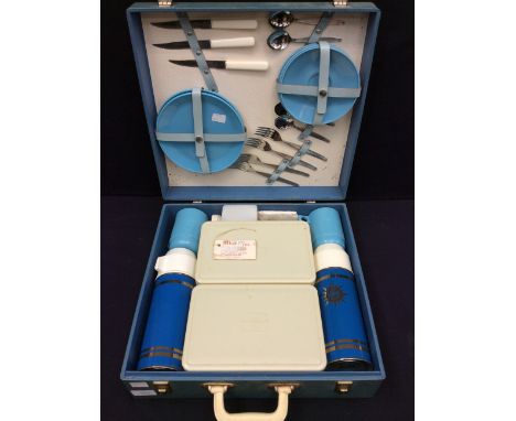 A 1960s complete picnic set in light blue carry case.