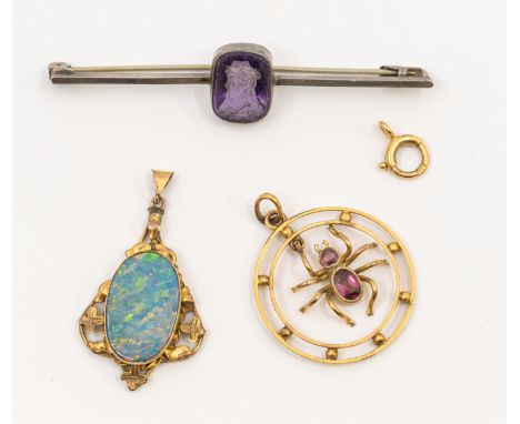 A late Victorian 9ct gold and garnet set inset pendant, circular design suspending a garnet set spider, size approx 24mm, tot