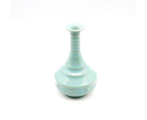A blue glazed Jun-ware flask shaped bottle vase with light brown crazing, several bosses and five stilt marks, 13cm high appr