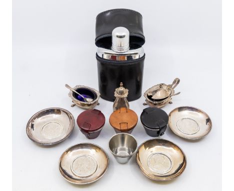 A Queen Elizabeth II silver cruet set consisting of mustard pot with blue glass liner, salt cellar with blue glass liner and 