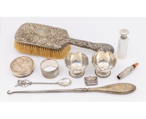 A collection of mixed silver items to include; a late Victorian silver hand brush, foliage/floral design, Birmingham, 1900, a