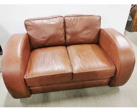 An arch armed leather two seater settee/ sofa, H. 85cm D. 97cm W. 160cm.