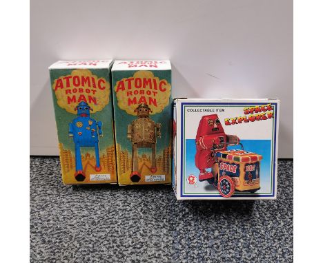 Two boxed tin plate robot toys, box size 14cm. Together with a box tin plate space explorer.