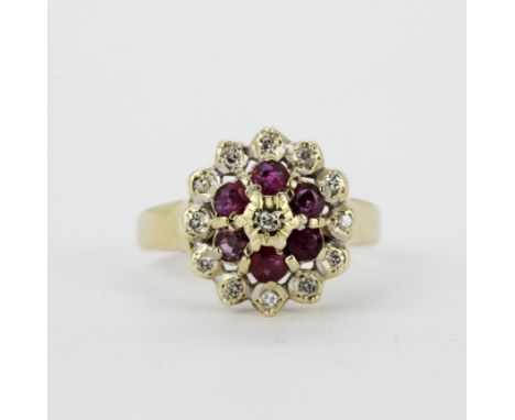 A hallmarked 9ct yellow gold diamond and ruby cluster ring, (R.5).