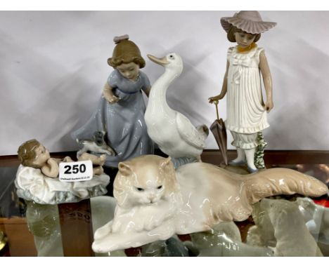 A group of five Nao porcelain figurines, one repaired.