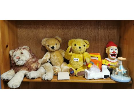 A Merrythought teddy bear and other mixed toys.