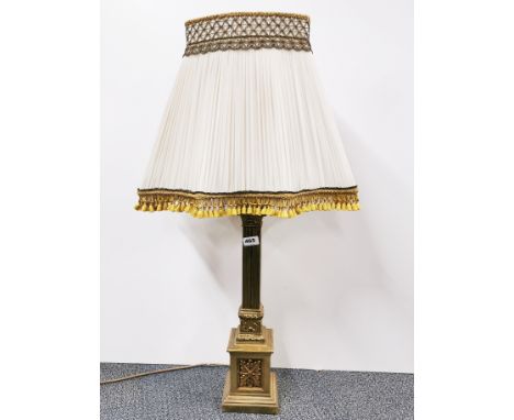 A large gilt brass table lamp and shade, H. 89cm.