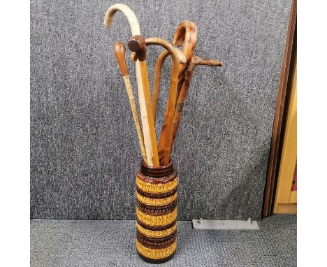 A 1960's pottery vase/stick stand, H. 41cm. Together with a group of walking sticks and two 1960's stools.