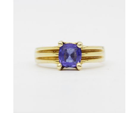 A 14ct yellow gold (marked 14K) tanzanite set solitaire ring, (M.5).