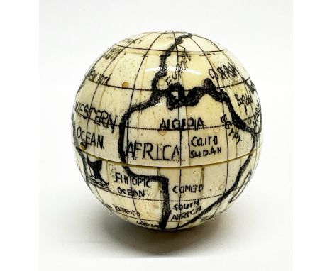 A Scrimshaw style carved bone globe compass, Dia. 7cm.