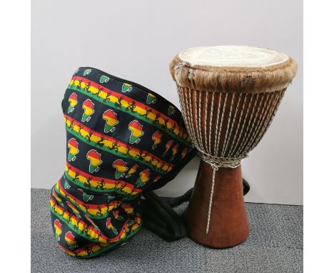 A bongo drum and case, H. 60cm.